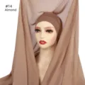 Detailed view of the almond chiffon hijab scarf and matching inner cap set on a mannequin. - Almond