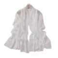 Detailed view of a white chiffon long scarf featuring elegant rhinestone polka dots. - Cream White