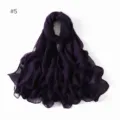 Detail shot of the solid dark purple lightweight polyester scarf, elegant drape texture. - 5