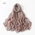Detailed view of lightweight solid color voile long scarf fabric texture and soft drape. - 12