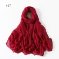 Detail shot of a lightweight solid red polyester long scarf, perfect for travel and daily wear. - 17