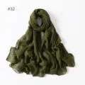 Detailed view of solid color voile long scarf in dark army green, lightweight texture. - 32