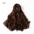 Close-up detail of the lightweight brown polyester voile scarf, soft fabric texture view. - 42