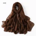Detailed view of solid brown polyester voile long scarf, lightweight and breathable. - 49