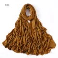 Detailed close-up of soft modal jersey hijab scarf in caramel brown, showing smooth texture. - No.30