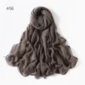 Close-up detail of lightweight solid color grey long scarf, delicate sheer fabric texture for travel. - 56