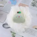 White mesh shower sponge detail with cute green fruit plush toy and hanging cord. - Lime