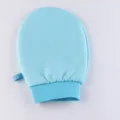 Exfoliating bath glove in solid blue color, thick design for gentle body scrubbing and shower use. - Blue