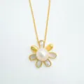 Detailed close-up of a gold flower pearl pendant necklace with mother of pearl inlay and fine chain. - Pendant Only (Without Chain) / Natural Pearl / Gold
