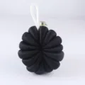 Black pumpkin mesh bath sponge detail, minimalist shower loofah with hanging loop. - Black