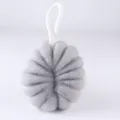 Grey mesh bath sponge close-up showing dense foaming texture and white hanging loop. - Light Gray