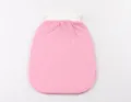 Exfoliating bath mitt detail view, showing the pink textured body and white elastic hanging cuff. - Pink