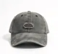 Washed distressed grey baseball hat featuring a curved brim and stylish embroidered logo patch. - Gray