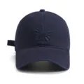 Classic navy blue baseball cap featuring tonal floral embroidery, casual outdoor sun hat. - Navy Blue