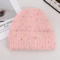 Pink knitted beanie hat with colorful speckles for cozy autumn and winter daily wear. - Pink