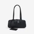 Minimalist black leather shoulder bag for women, retro underarm handbag with chic long straps. - 30x9x12cm / Black
