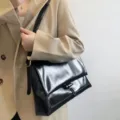 Black glossy leather shoulder bag for women, chic commuting messenger bag main view - S / Black