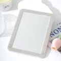 Detailed view of the rhinestone makeup mirror, showing exquisite crystals and clear glass. - 17.5*13.2cm / White AB