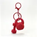 Red mini fitness keychain with dumbbell and kettlebell charms, perfect backpack accessory. - Red
