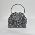 Sparkling rhinestone bucket evening bag detail, featuring dazzling crystals and metal handle. - Black and White