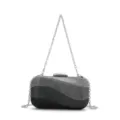 Close-up view of the sparkling rhinestone evening clutch showcasing exquisite wavy design and chain. - Black Gradient