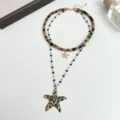Collier ras de cou double couche motif leopard et etoile de mer avec perles noires. - Collier Double Couche Étoile Léopard