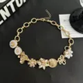 Collier ras de cou floral rétro et lourd, bijoux élégants de style punk gothique doré. - Collier Choker Fleur Dorée