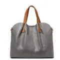 Detailed close-up view of the soft leather tote bag showing fine stitching and hardware. - Gray