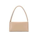 Minimalist beige baguette shoulder bag detail, smooth leather texture and elegant single strap. - Apricot