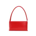 Red leather baguette underarm bag detail, minimalist chic single shoulder handbag strap view. - Red