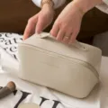 Beige large capacity portable makeup bag, premium travel cosmetic organizer with top handle. - Off White