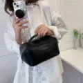 Black large capacity cosmetic bag, portable toiletry storage bag for travel and daily commute. - Black