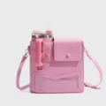 Pink tumbler carrier bag with adjustable strap and front pocket detail for travel. - Pink