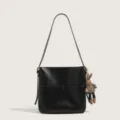 Chic black bucket shoulder bag with cute bunny charm, stylish casual commuter crossbody bag. - With Doll Pendant / Black