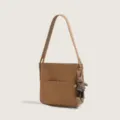 Chic minimalist shoulder bag for women, versatile brown commuting crossbody bucket bag. - With Doll Pendant / Brown
