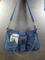 Blue denim shoulder bag for women, stylish underarm bag with star patches and chain strap. - Blue