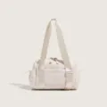 Detailed view of beige nylon sports fitness bag with dual handles and side pockets for travel. - White