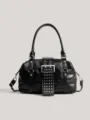 Black rivet motorcycle shoulder bag with metal buckle and top handle for women commuting. - Black