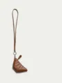 Mini brown croissant coin purse with long lanyard, stylish mini handbag detail display. - Standard / Brown