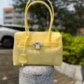 Yellow PVC jelly handbag with metal lock, stylish shoulder tote bag for women daily use. - Milky Yellow Small