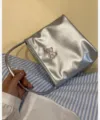 Silver metallic shoulder bag with pink butterfly embroidery for women, trendy daily accessory. - Silver
