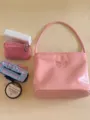 Pink leather underarm shoulder bag with delicate butterfly embroidery detail for stylish women. - Pink