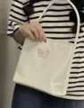 Stylish women's silver shoulder underarm bag with cute pink butterfly embroidery. - White