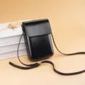 Minimalist vertical black crossbody phone bag, compact PU leather mini shoulder bag for women. - Black