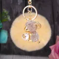 Plush pompom sheep keychain detail, cute crystal holding animal bag charm, gold keyring accessory. - White Sheep + Beige Pom Pom