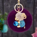 Rhinestone ram keychain detail, sparkling crystal and fluffy purple pom pom pendant accessory. - Blue Sheep + Dark Purple Pom Pom