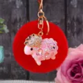 Cute rhinestone pink sheep keychain with red plush pom pom, elegant metal bag charm accessory. - Pink Rhinestone Sheep + Red Plush Ball
