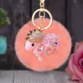 Cute pink plush sheep keychain with sparkling rhinestones and gold metal clasp for bag decor. - Pink Rhinestone Sheep + Korean Pink Plush Ball