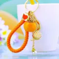 Cute persimmon keychain metal charm for car keys and bags, lovely pendant accessory detail view. - Orange Rope + Persimmon Lotus Orange