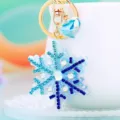 Rhinestone snowflake keychain detail view, sparkling blue crystal pendant for bags and car keys. - Single OPP Bag Packaging / A820 Rhinestone Snowflake Blue Gradient